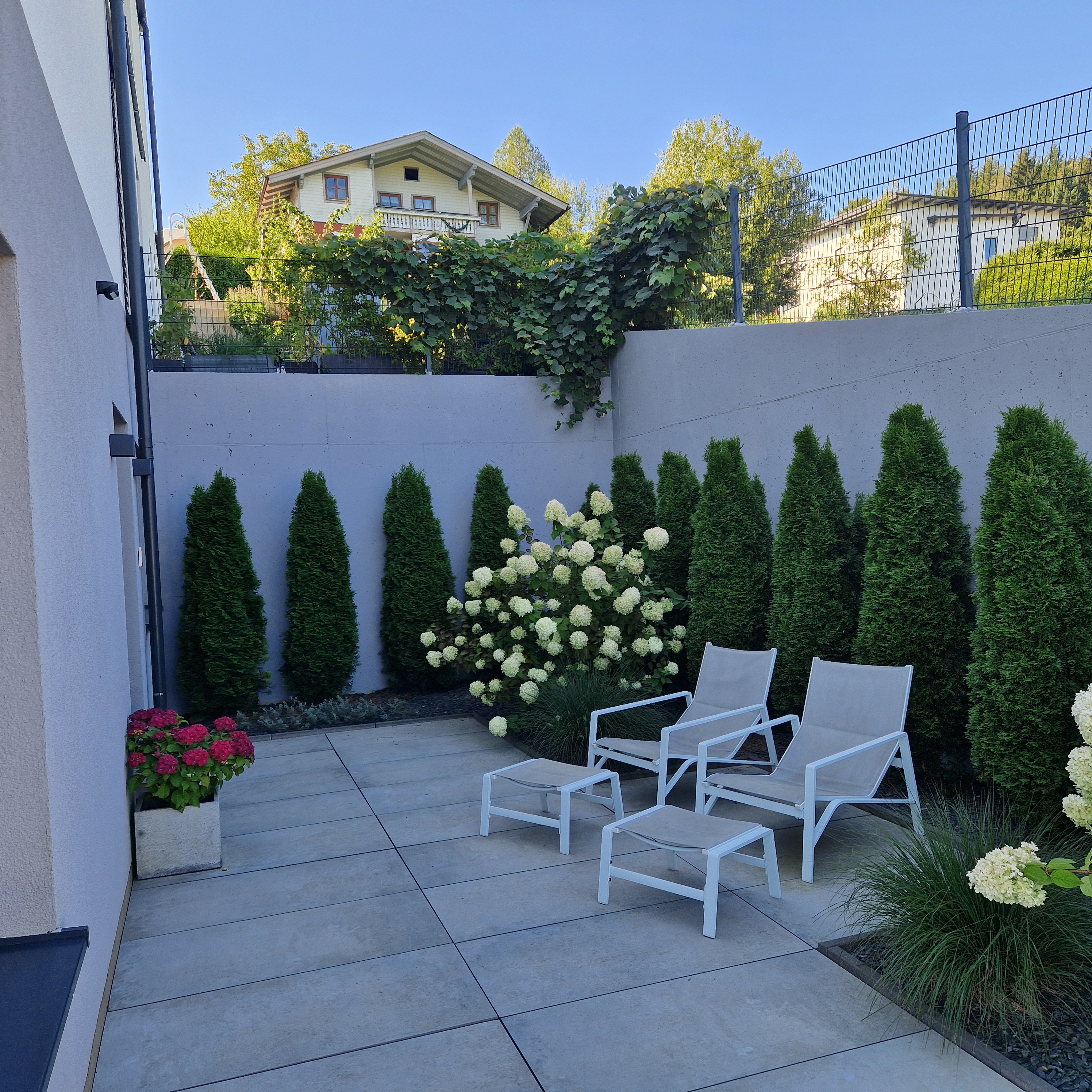 Private terrace with garden and lounge chairs